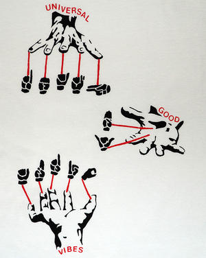 Close-up of graphics of sign language hands signing Death By Audio with text Universal Good Vibes.